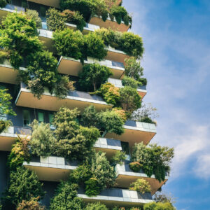 Green futuristic skyscraper Bosco Verticale, vertical forest apartment building with gardens on balconies. Modern sustainable architecture in Porta Nuova district,  Milan, Italy.